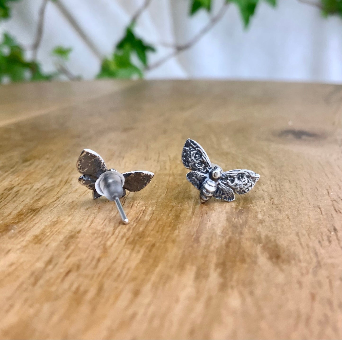 Silver Moth stud earrings