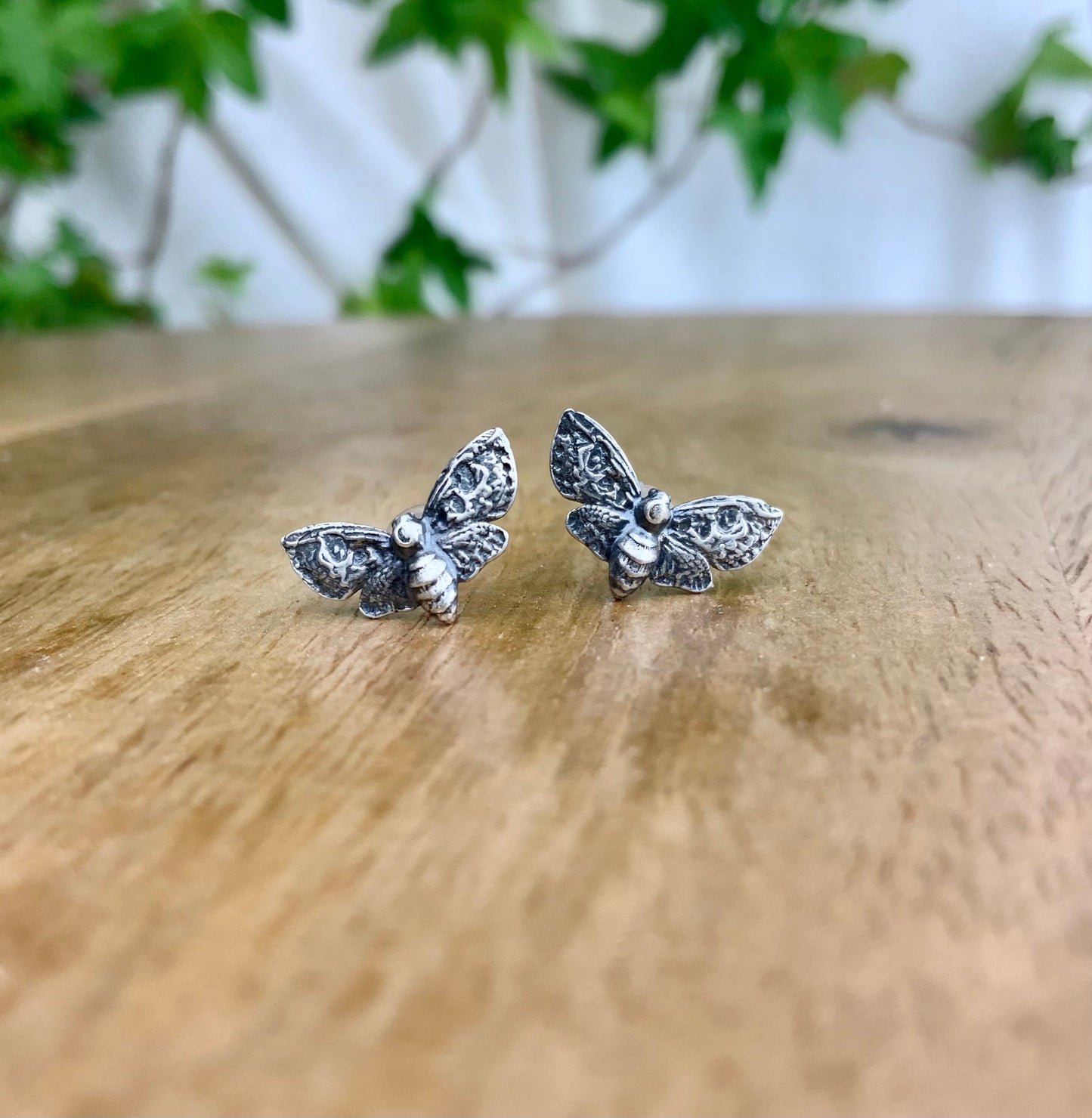 Silver Moth stud earrings