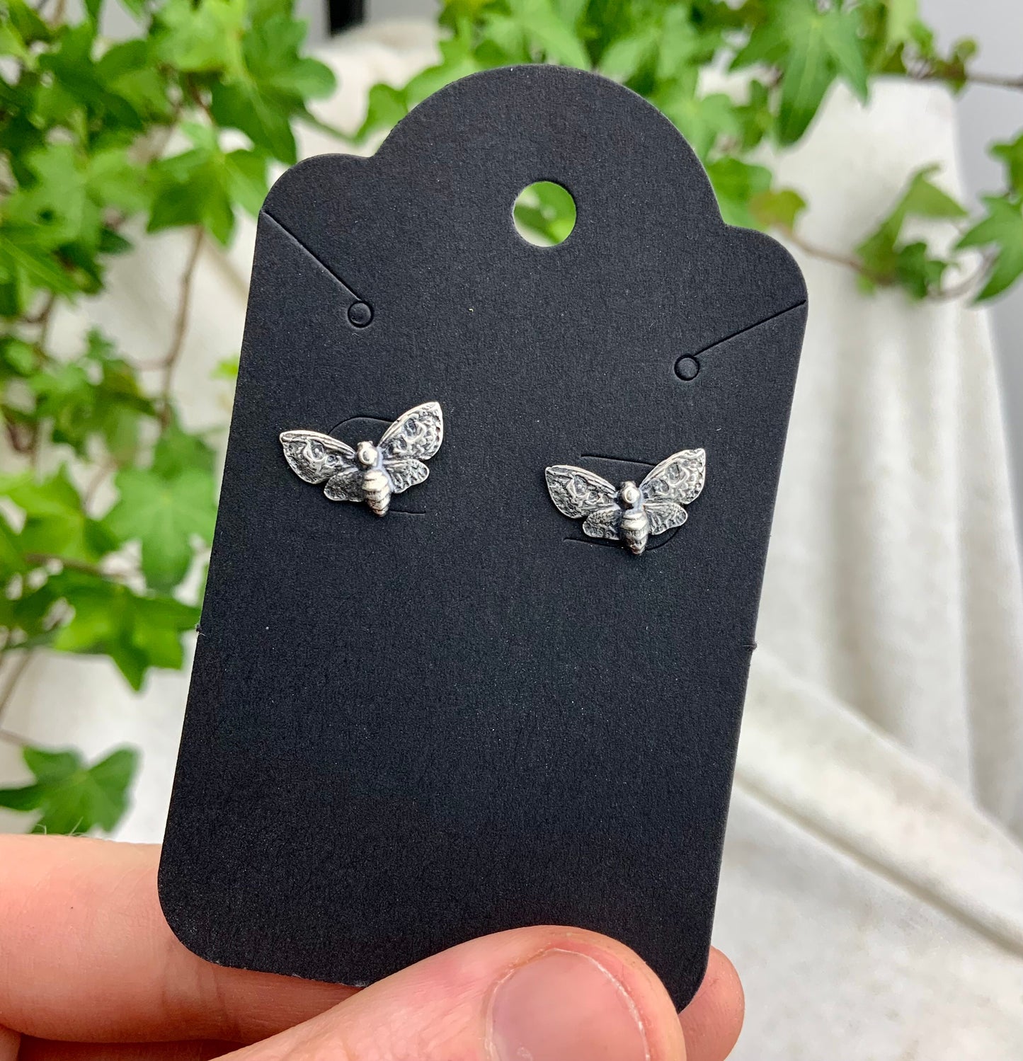 Silver Moth stud earrings