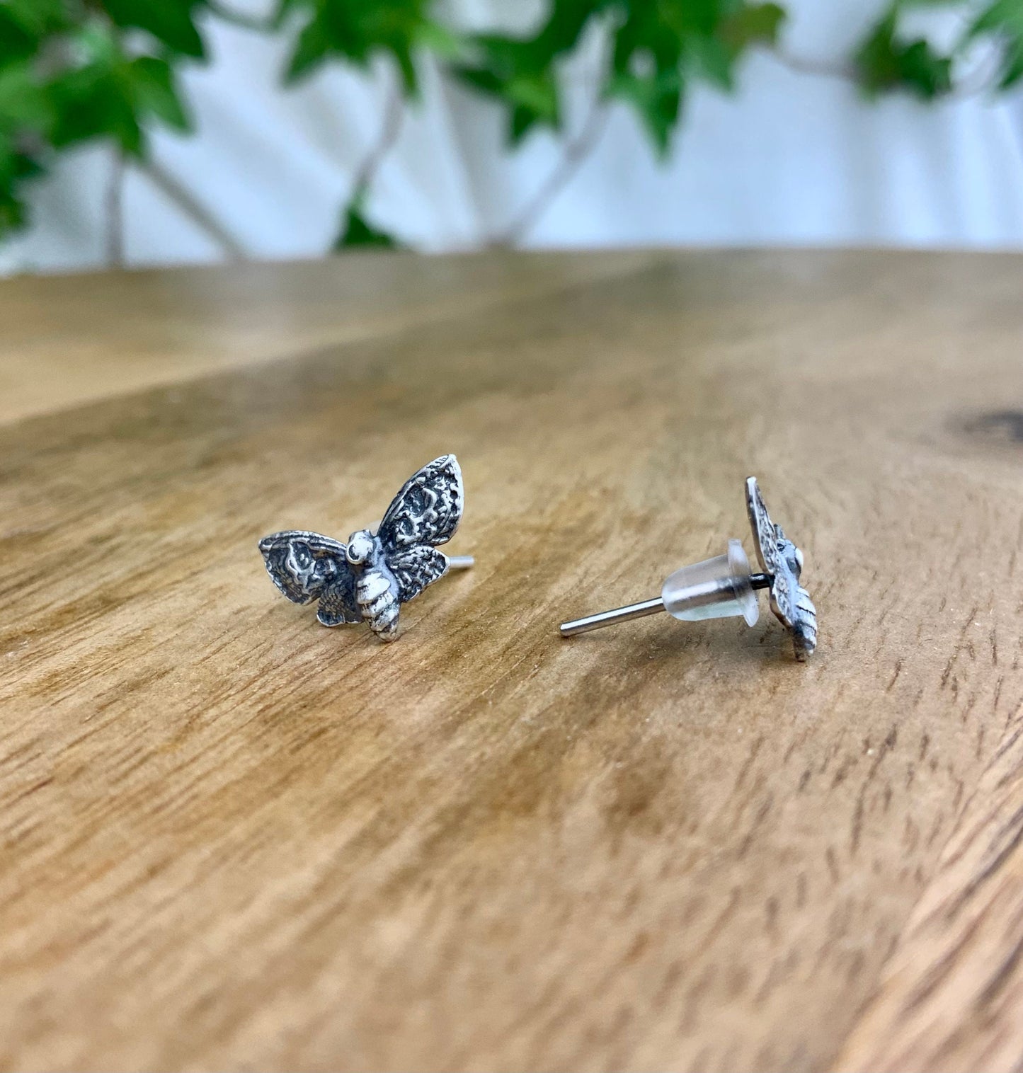 Silver Moth stud earrings